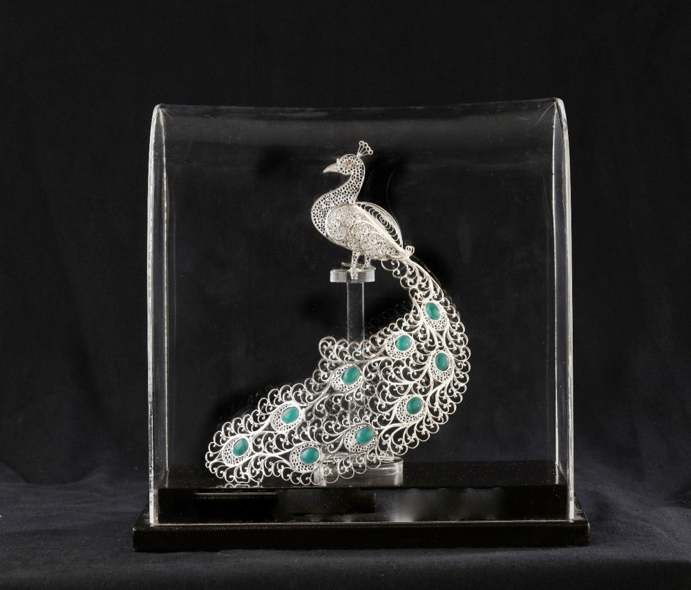 An intricate silver filigree peacock from Karimnagar, Telangana