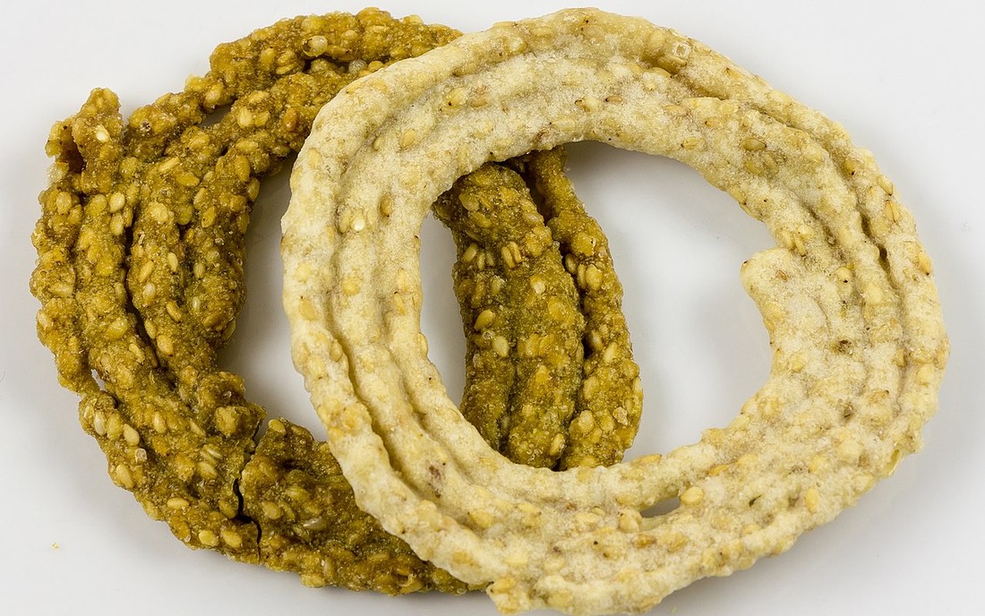Sakinalu, deep-fried spiral rice-flour rings studded with sesame, a Telangana festive snack