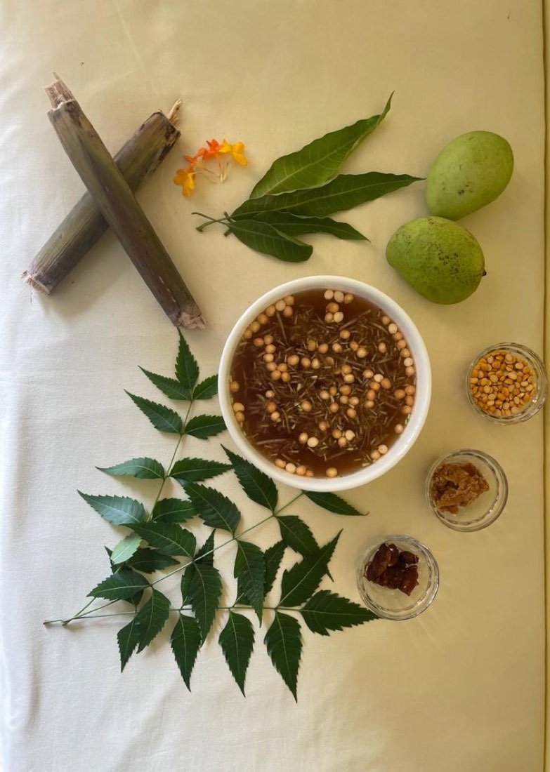 A bowl of ugadi pachadi with neem flowers and raw mango, the symbolic Ugadi dish
